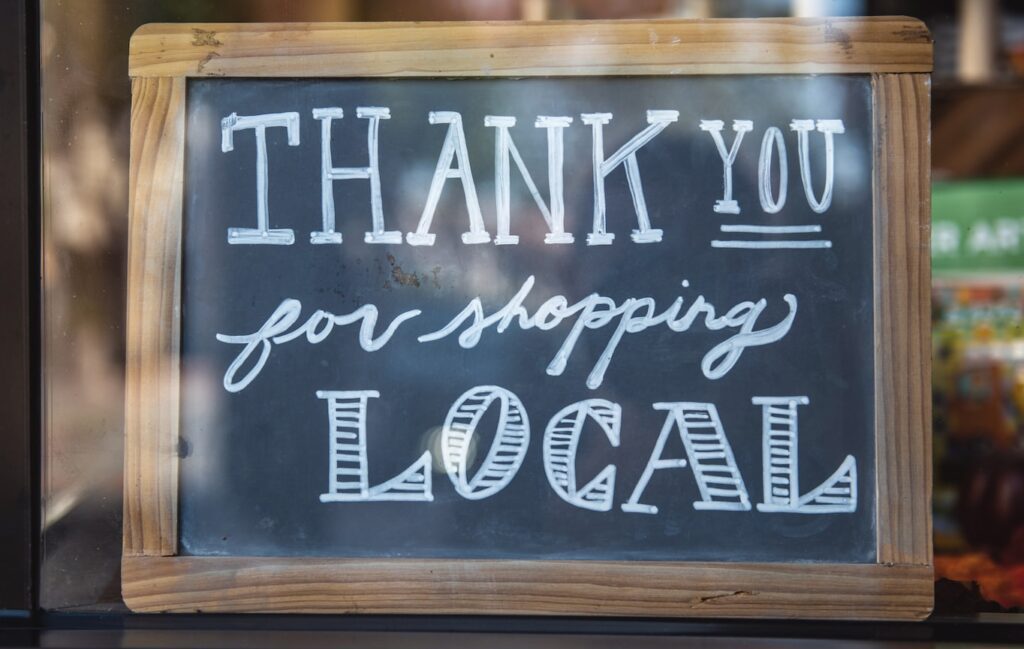 shallow focus photo of thank you for shopping signage